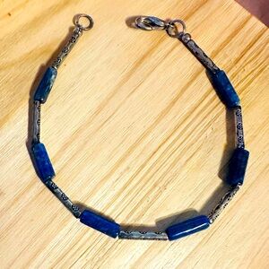 Lapis Lazuli bracelet w/silver plated accents. Can be worn by itself or stacked.